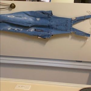 Bluejean Overalls with holes.